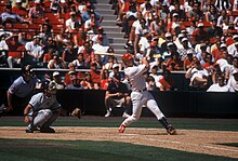 McGwire batting during a May 1998 game Mark McGwire follow-thru Piazza catching-53.jpg