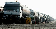 A convoy of civilian Mercedes-Benz Actros trucks in Iraq waiting for inspection. The vehicles are built in the Cairo plant of MCV. Mercedes-Benz trucks in Iraq.JPG