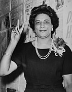 Mrs. Constance B. Motley, first woman Senator, 21st Senatorial District, N.Y., raising hand in V sign