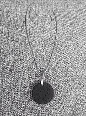 A necklace made from the ash of the 2010 eruption: Jewellery and similar memorabilia of the eruption are now sold in Iceland.