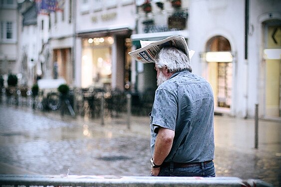 Newspaper hat in the rain