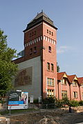 Tower building with elevator inside and sgraffito "Waggonbau Niesky OL"