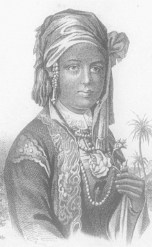 A young woman with dark skin, wearing a silken headscarf, pearls, and a lace-trimmed robe