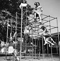 People on playground equipment (6169726789).jpg