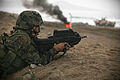 Peruvian naval infantryman prone with F2000 at the ready