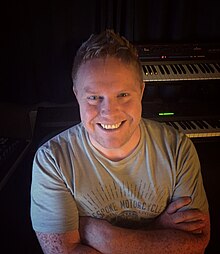 Peter Connelly (pictured 2016) acted as the composer for Tomb Raider: The Last Revelation, having previously worked on sound design for Tomb Raider III. Peter Connelly (September 2016).jpg