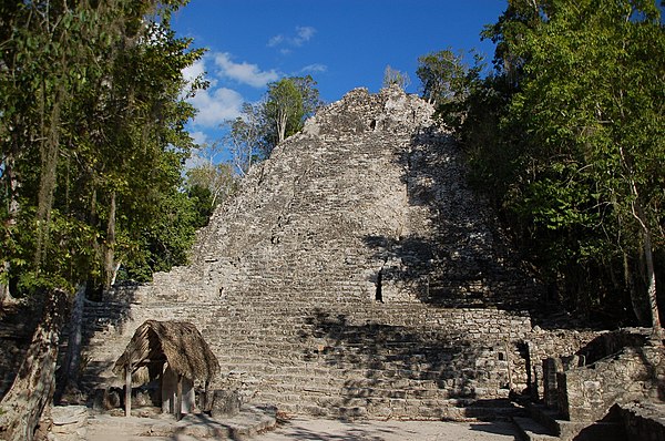 Front view of the pyramid structure known as "La Iglesia" in the Group B, or Cobá Group, complex. Stela 11 is in the foreground at the base of the pyr