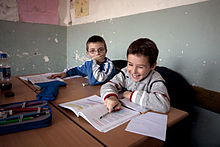 Children studying in a primary school in Gjakova Roma children studying together with Kosovar children, Primary School Emin Duraku, Gjakove, Kosovo.jpg