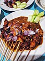 Chicken satay sprinkled with bawang goreng and sliced fresh shallot