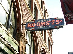 An old sign on Seattle's Delmar Building / State Hotel. Used by Clipper Vacations Magazine.