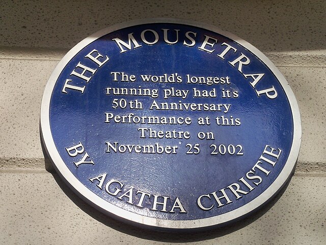 Blue plaque marking the 50th anniversary of The Mousetrap on the front wall of St Martin's Theatre, London