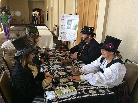 Cosplayers (left) receive steampunk tarot readings at the 2015 Salt City Steamfest