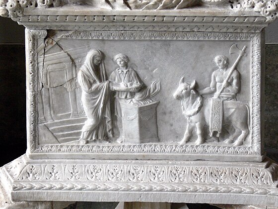 Roman relief depicting a scene of sacrifice, with libations at a flaming altar and the victimarius carrying the sacrificial axe
