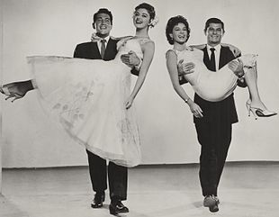 Publicity still for Ten Thousand Bedrooms, with Dean Martin holding Anna Maria Alberghetti, and Dewey Martin holding Bartok Ten Thousand Bedrooms (1957) still 2.JPG