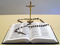 Christian culture symbols: Christian Bible, rosary, and crucifix. Thebible33.jpg