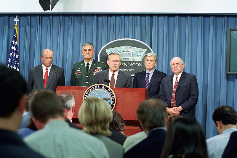 File:U.S. Secretary of Defense, Donald H. Rumsfeld, (background center), speaks to the media shortly after terrorist's crashed American Airlines flight 77 into the Pentagon 010911-D-SN666-033.jpg
