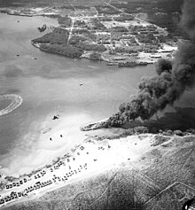 LST-480 burns again on 23 May 1944. The sunken LST-353 where the disaster originated lies off her starboard bow USS LST-480 fire2.jpg