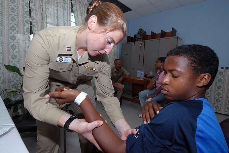 File:US Navy 070917-N-8704K-072 Lt. Gwen Smith, attached to Military Sealift Command hospital ship USNS Comfort (T-AH 20), performs physical therapy for Marcus Pryce at the Arima Health Facility.jpg