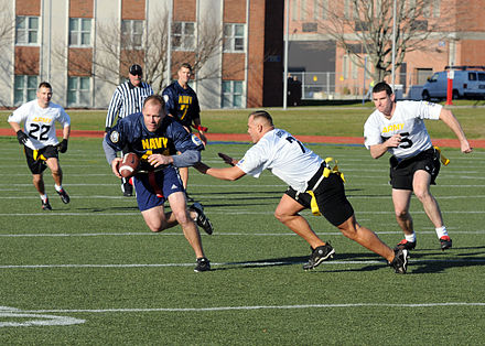 Men playing a game of flag football