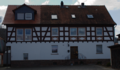 English: Half-timbered building in Wartenberg, Angersbach, Baumgartenweg 11, Hesse, Germany.