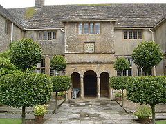 Two storey house with columns in front of the: door