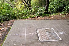 The Willamette Stone's location is now commemorated by a circular marker and plaque. Willamette Stone, in western Portland, OrR.jpg