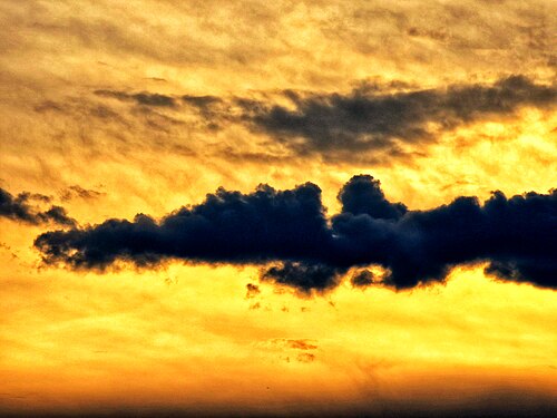 Sunset with clouds in silhouette.