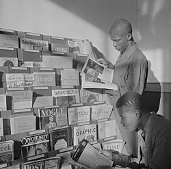 1943 magazine rack and two students at Bethune-Cookman College Daytona Beach, Florida in the library reading room - (LOC) (cropped).jpg