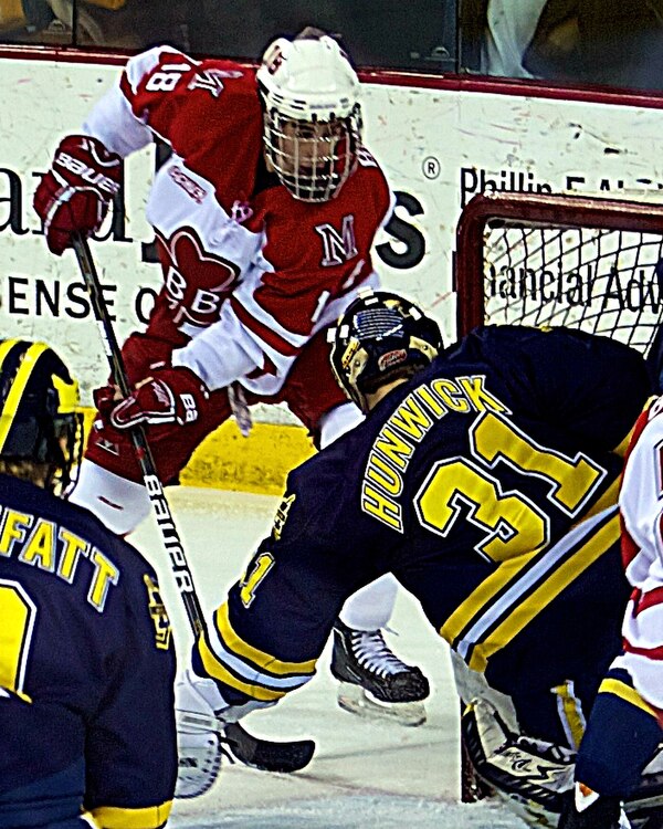 Smith (left) with the RedHawks, February 2011