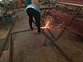 A Student Welder Exhibiting His Talent At Tamale Technical University Practice