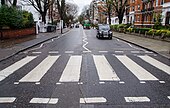 Abbey Road crosswalk in London, where the band "The Beatles" took a famous photo while they crossed it