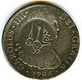 Anverso de moneda de 8 reales (plata) de Carlos IV de 1796 con resello de Adén.