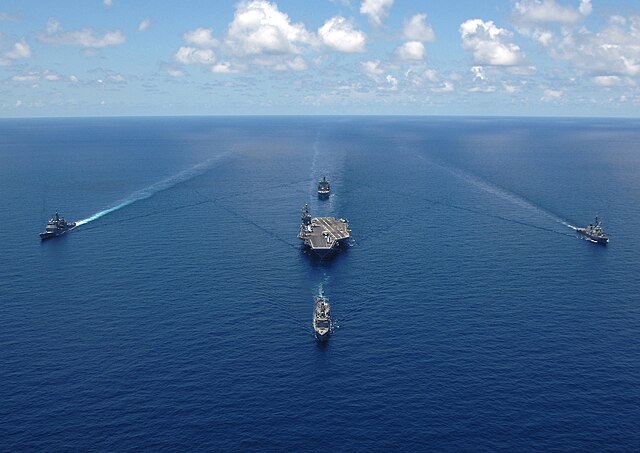 USS George Washington Carrier Strike Group sails in formation for a strike group photo in the Caribbean Sea 29 April 2006. Such a formation, referred 