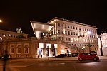 The Albertina Vienna, lit up in the evening.