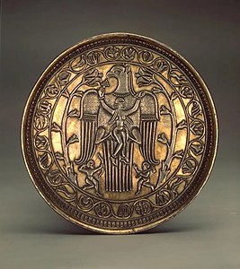 A similar scene on a Sassanid silver plate from the 7th century; decorated with an eagle carrying a woman, the plate was found in Cherdynsky District in the Soviet Union in 1934, now in the Hermitage Museum in Saint Petersburg.