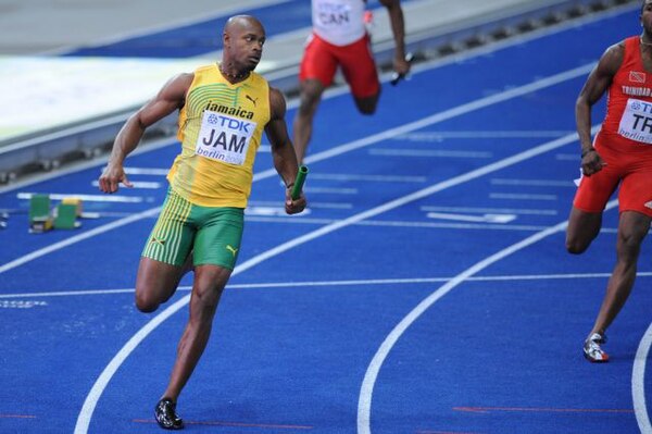 Powell anchoring the Jamaican relay team to a World Championship gold medal