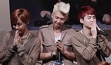 J-Hope pictured with fellow BTS rappers RM (middle) and Suga (right) in September 2014. He cites the two as reasons why he enjoys music. BTS at a fansigning in Jongro, 7 September 2014 (cropped).jpg