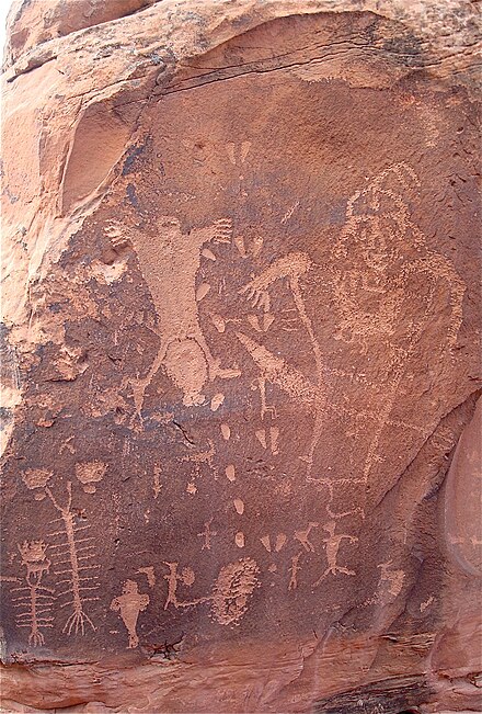 Located just west of town, the Birthing Rock petroglyph depicts a rare breach birth (center left).