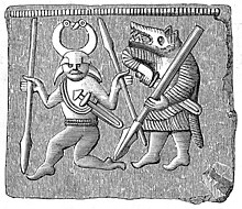 A Vendel era bronze plate found on Oland, Sweden depicting a wolf-pelt warrior drawing a sword beside a dancing figure. Bronsplat pressbleck Oland vendeltid.jpg