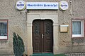 Granite portal of the inn