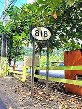 Sign for PR-818 in Barrio Pueblo, looking west