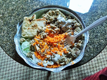 Rice with meat, vegetables and some pita bread from The Halal Guys