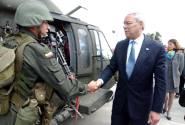 Former U.S. Secretary of State Colin Powell during a visit to Colombia greeted by a Colombian National Police patroller. Colpolwpowell.png