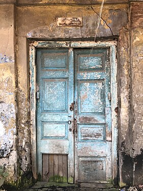 Decaying closed door of an old house, Kolkata, India