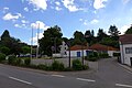 Lebensmittelmarkt in der Düppenweilerstraße vor dem Abriss; in der Bildmitte die historische Linde