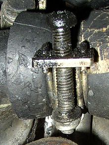 A (somewhat dirty and overtightened) wire clamp, used on an automotive radiator Dirty wire Hose Clamp 2.jpg