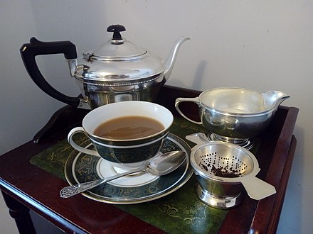 English silver teapot with teaware