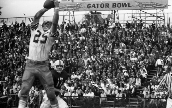 Biletnikoff (in white) catching a pass in the 1965 Gator Bowl
