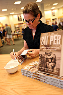 Cavallaro signing her book Gina Cavallaro Marines picture.jpg