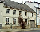 Residential house with side wing and courtyard building